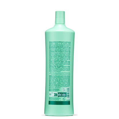 Mint green bottle of purifying shampoo for oily hair and dandruff, made in Italy with professional quality ingredients.