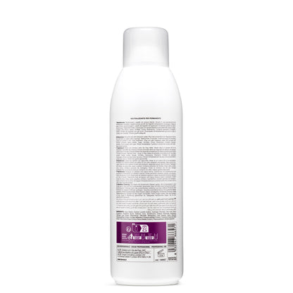 White bottle of permanent hair neutralizer with multilingual instructions, made in Italy for professional use