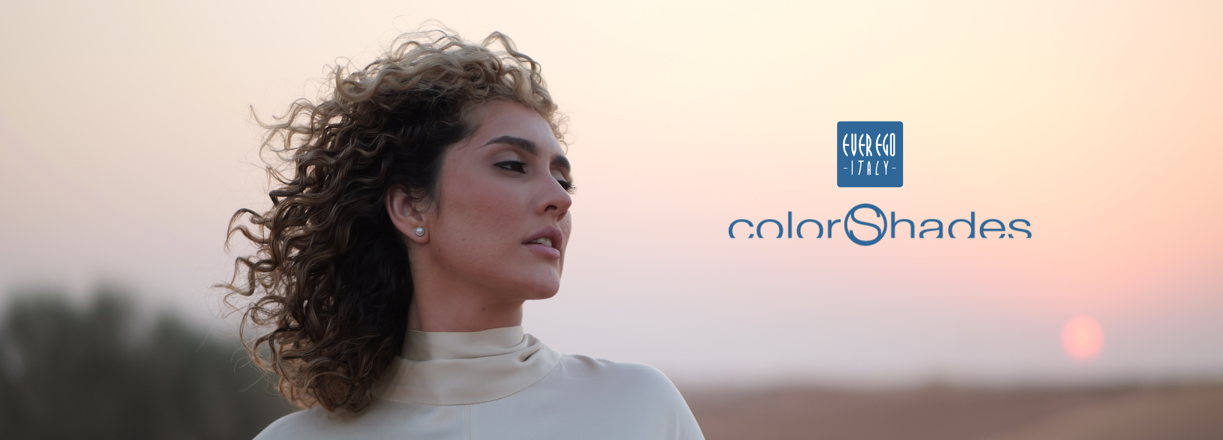 Woman with curly hair at sunset, Ever Ego Italy colorShades beauty collection